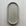 Oval (pill shaped) concrete trinket tray in natural grey.