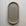 Oval (pill shaped) concrete trinket tray in taupe.